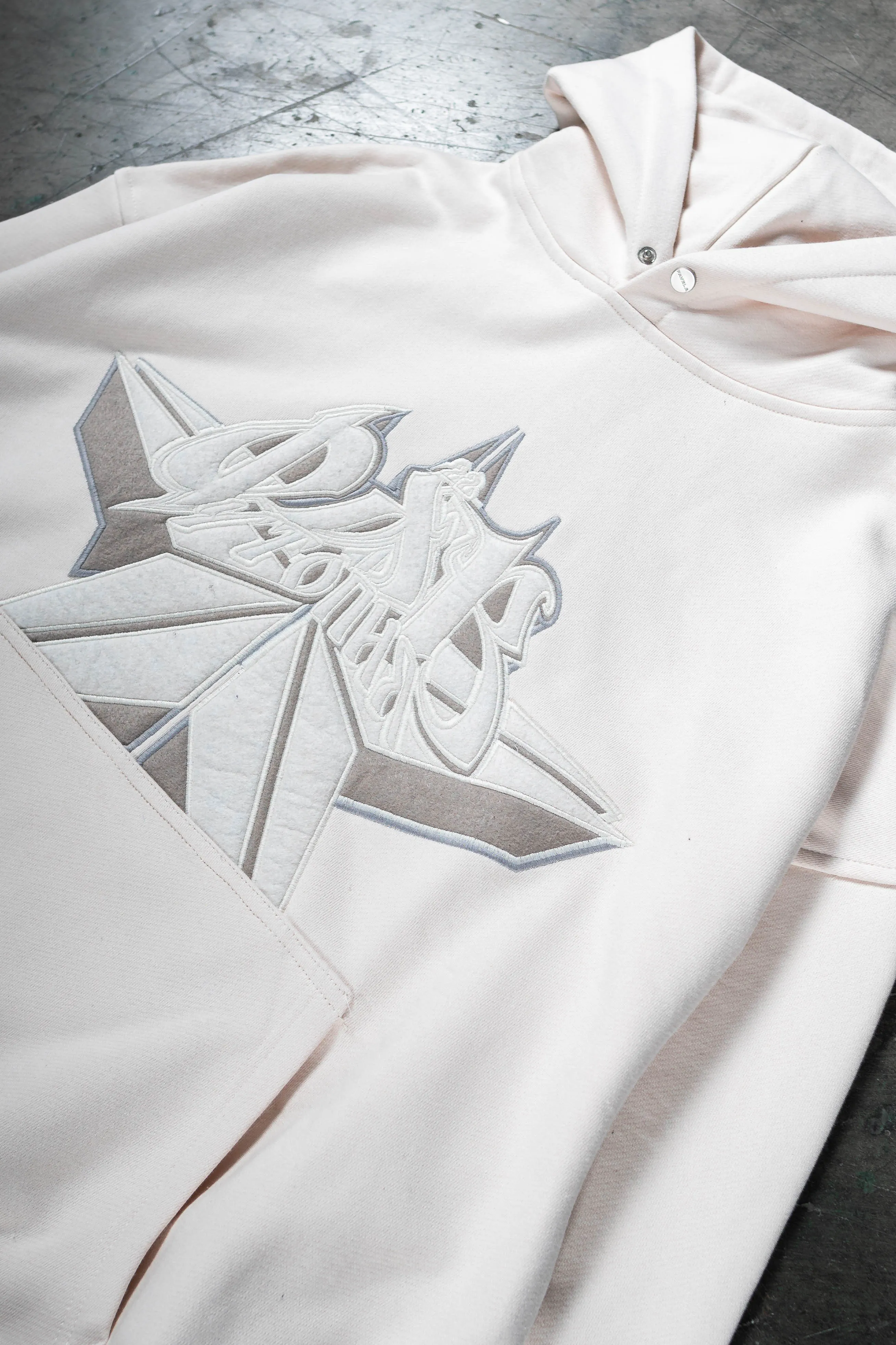 CYRILLIC STAR OFF WHITE SNAP BUTTON HOODIE